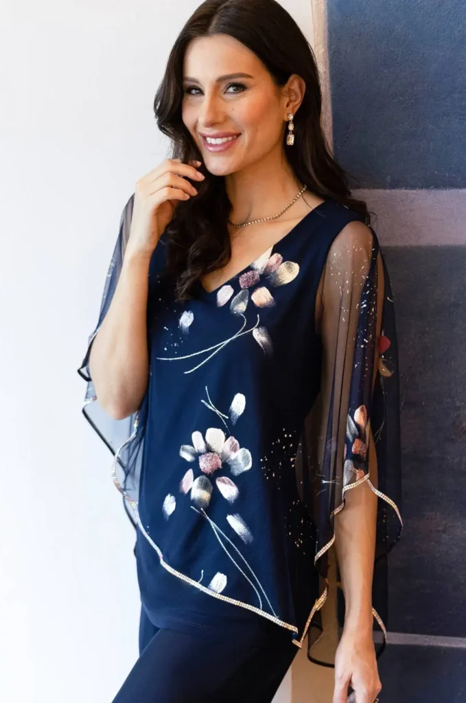 Frank Lymanin sininen tunika hopeareunalla ja kukilla